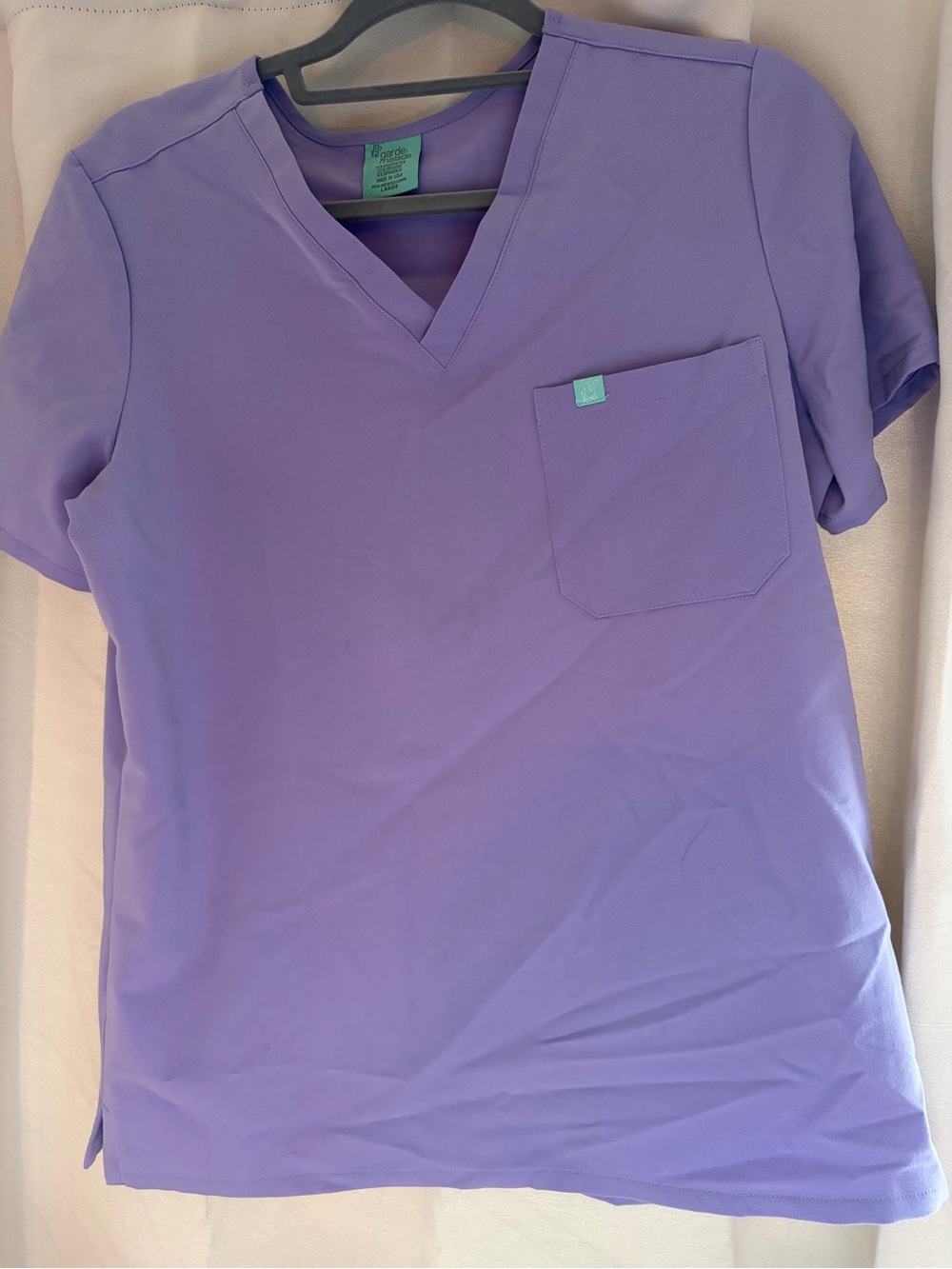 Women’s Garde Malade purple scrub top